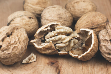 Crushed Walnut on the wood background. Close up.