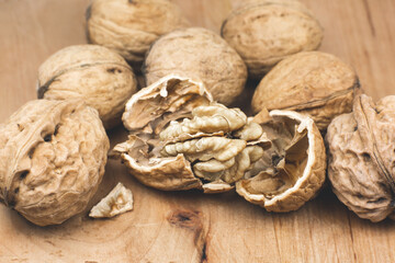 Crushed Walnut on the wood background. Close up.