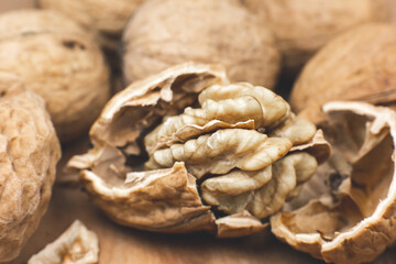 Crushed Walnut on the wood background. Close up.