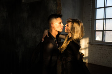 Portrait of Couple two professional ballroom dancers in loft studio. Sport life concept. Passion and emotional dance.