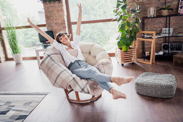 Full length body size photo woman sitting careless in armchair smiling relaxing on holiday