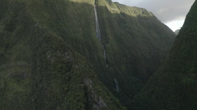 Aerial view of a waterfall (La Cascade Blanche) among the mountain landscape near Saint Andr&egrave;, Saint Benoit, Reunion.