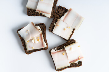 sandwich black bread with bacon