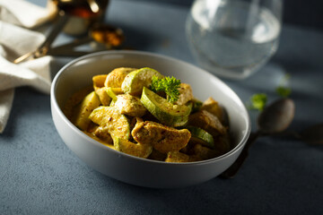 Healthy homemade zucchini curry with fresh parsley