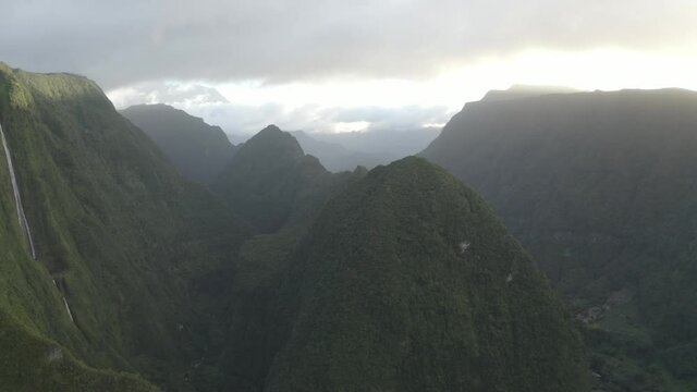 Aerial view of a waterfall (La Cascade Blanche) among the mountain landscape near Saint Andr&egrave;, Saint Benoit, Reunion.