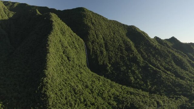 Panoramic aerial view of mountain landscape during a sunny day near Cascade de Takamaka, a waterfall near Saint Benoit, Reunion.