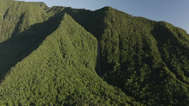 Panoramic aerial view of mountain landscape during a sunny day near Cascade de Takamaka, a waterfall near Saint Benoit, Reunion.