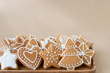 Christmas gingerbread cookies on brown background	
