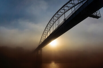 Peizaz on a beautiful foggy autumn morning and a bridge over the river. Gomel.