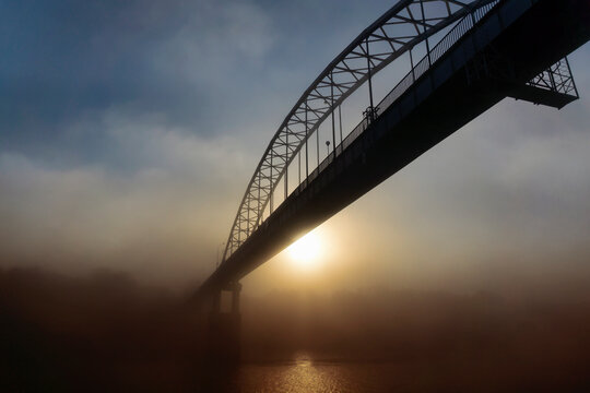 Peizaz on a beautiful foggy autumn morning and a bridge over the river. Gomel.