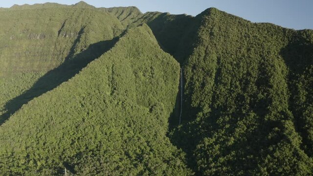 Panoramic aerial view of mountain landscape during a sunny day near Cascade de Takamaka, a waterfall near Saint Benoit, Reunion.