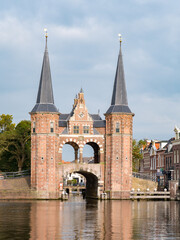 Waterpoort, water gate, and Kolk canal in city of Snits, Sneek in Friesland, Netherlands