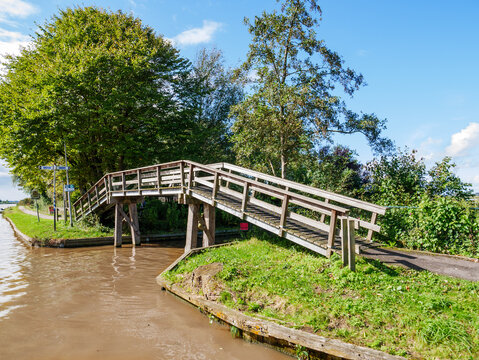 Wooden bridge for cycles and pedestrians by Dokkumer Ee in Bartlehiem, Friesland, Netherlands