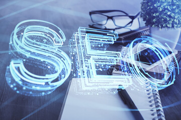Double exposure of SEO drawing and cell phone background. Concept of data search optimization