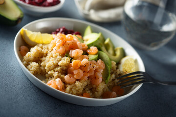 Healthy quinoa bowl with shrimps and avocado