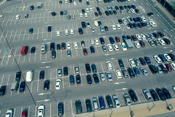 Big parking near shopping center or mall, top aerial view from high.