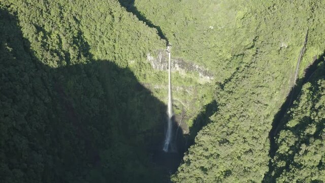 Aerial view of Cascade de La Grande Ravine, a beautiful waterfall among the wild mountains near Saint Benoit, Reunion.