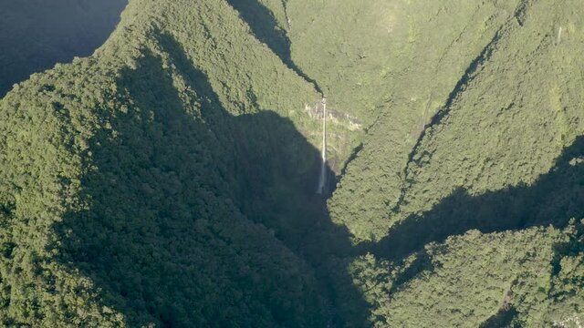 Aerial view of Cascade de La Grande Ravine, a beautiful waterfall among the wild mountains near Saint Benoit, Reunion.