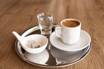 Traditional Turkish coffee with cold water and Turkish delight
