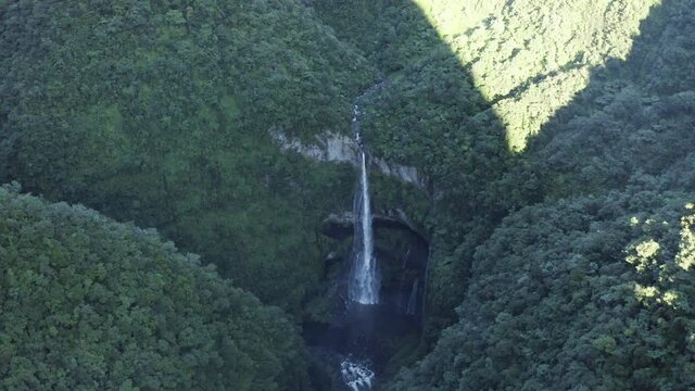 Aerial view of Cascade de La Grande Ravine, a beautiful waterfall among the wild mountains near Saint Benoit, Reunion.
