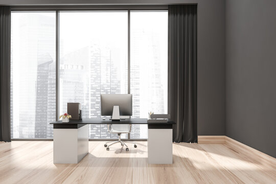 Grey office with white and black office desk