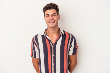 Fototapeta premium Young caucasian man isolated on white background happy, smiling and cheerful.