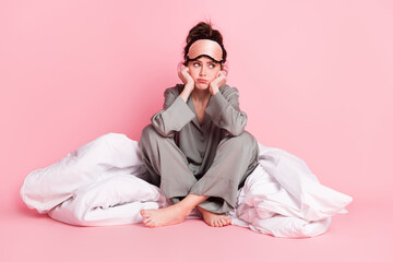 Full size photo of unsatisfied lady sit arms on cheeks look empty space sullen face isolated on...