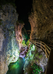 Obraz premium Cerrada of Castril river at night. Castril river between walkways and bridges. In the Andalusia community, Granada, Spain