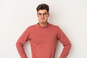 Young caucasian man isolated on white background sad, serious face, feeling miserable and displeased.