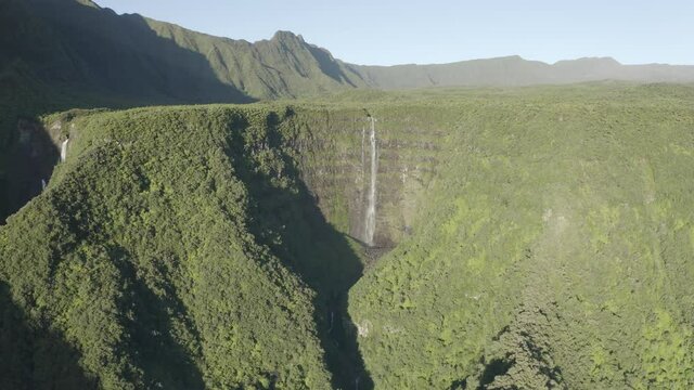Aerial view of Cascade de La Grande Ravine, a beautiful waterfall among the wild mountains near Saint Benoit, Reunion.
