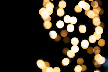 Christmas bokeh overlay background. Garland big light on the black background. New Year, festive atmosphere