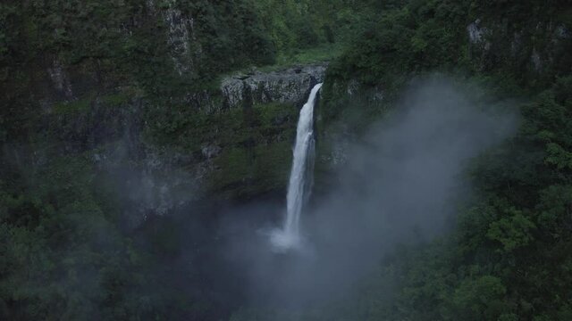 Aerial view of Cascade de La Grande Ravine, a beautiful waterfall among the wild mountains near Saint Benoit, Reunion.