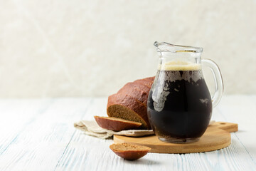 Traditional russian summer drink, kvass on wooden background. Space for text.