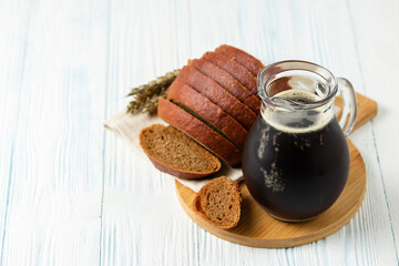 Bread kvass on wooden background. Space for text.