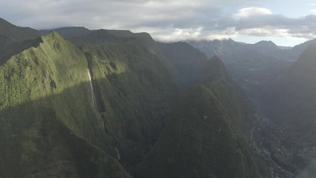 Aerial view of a waterfall (La Cascade Blanche) among the mountain landscape near Saint Andr&egrave;, Saint Benoit, Reunion.