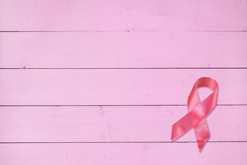 Pink ribbon on pastel background, Breast cancer awareness concept