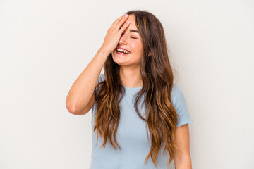Fototapeta premium Young caucasian woman isolated on white background laughing happy, carefree, natural emotion.