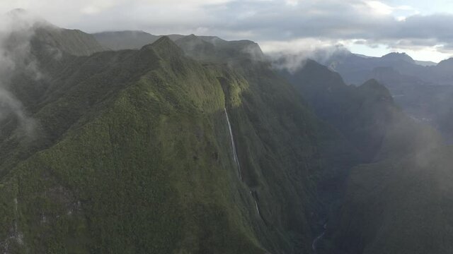 Aerial view of a waterfall (La Cascade Blanche) among the mountain landscape near Saint Andr&egrave;, Saint Benoit, Reunion.