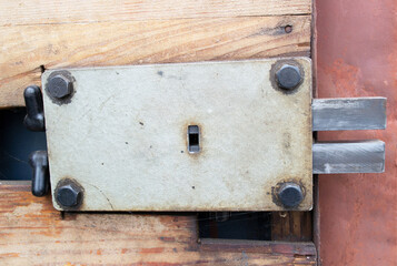 Old rusty built-in lock on a garage door