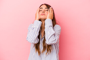 Young caucasian woman isolated on pink background whining and crying disconsolately.