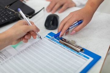 At the doctor's office, the patient completes a declaration on COVID-19