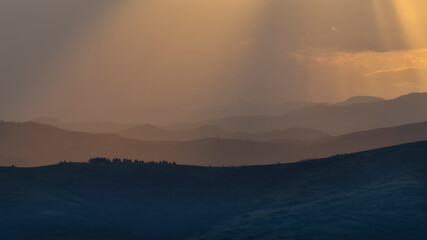 the curved hills seen to the sunset