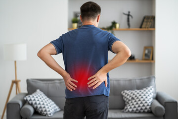 Back pain, kidney inflammation, man suffering from backache at home