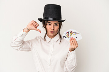 Young magician woman holding a wand isolated on white background feels proud and self confident, example to follow.