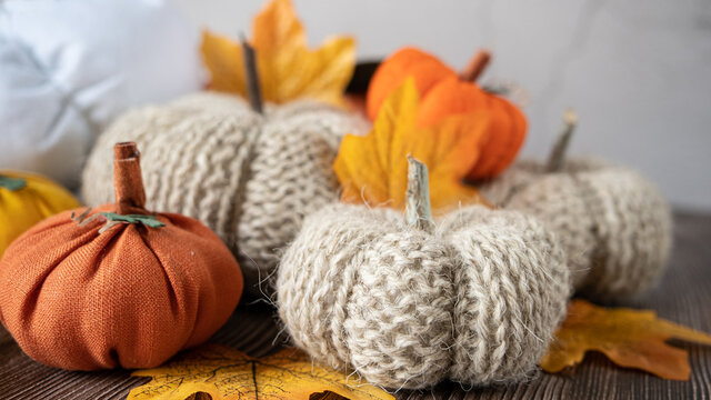 Hand Made Fabric Pumpkin Over Grey Knitted Blanket For Fall Home Decoration