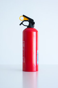 Small Portable Car Fire Extinguisher. Close Up Studio Shot, Isolated On White, No People