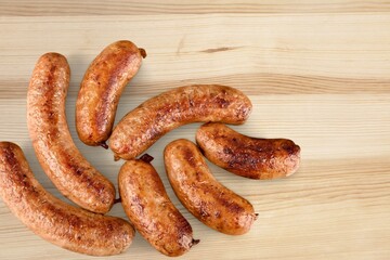 Set of different types of sausages, salami and smoked meat on the desk
