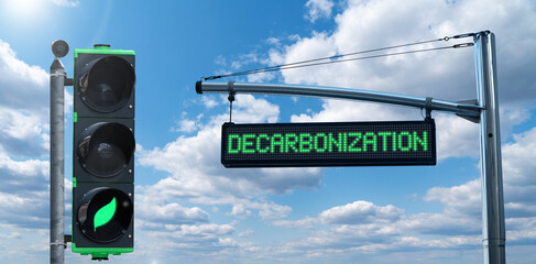 Traffic light with leaf symbol and road information board with text DECARBONIZATION on a background...