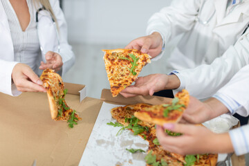 In between on-call duties, doctors eat pizza.