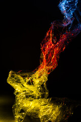 Abstract dark background with yellow, red and blue color